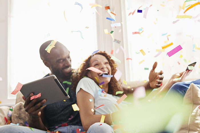 Couple playing Buzz Bingo together at home