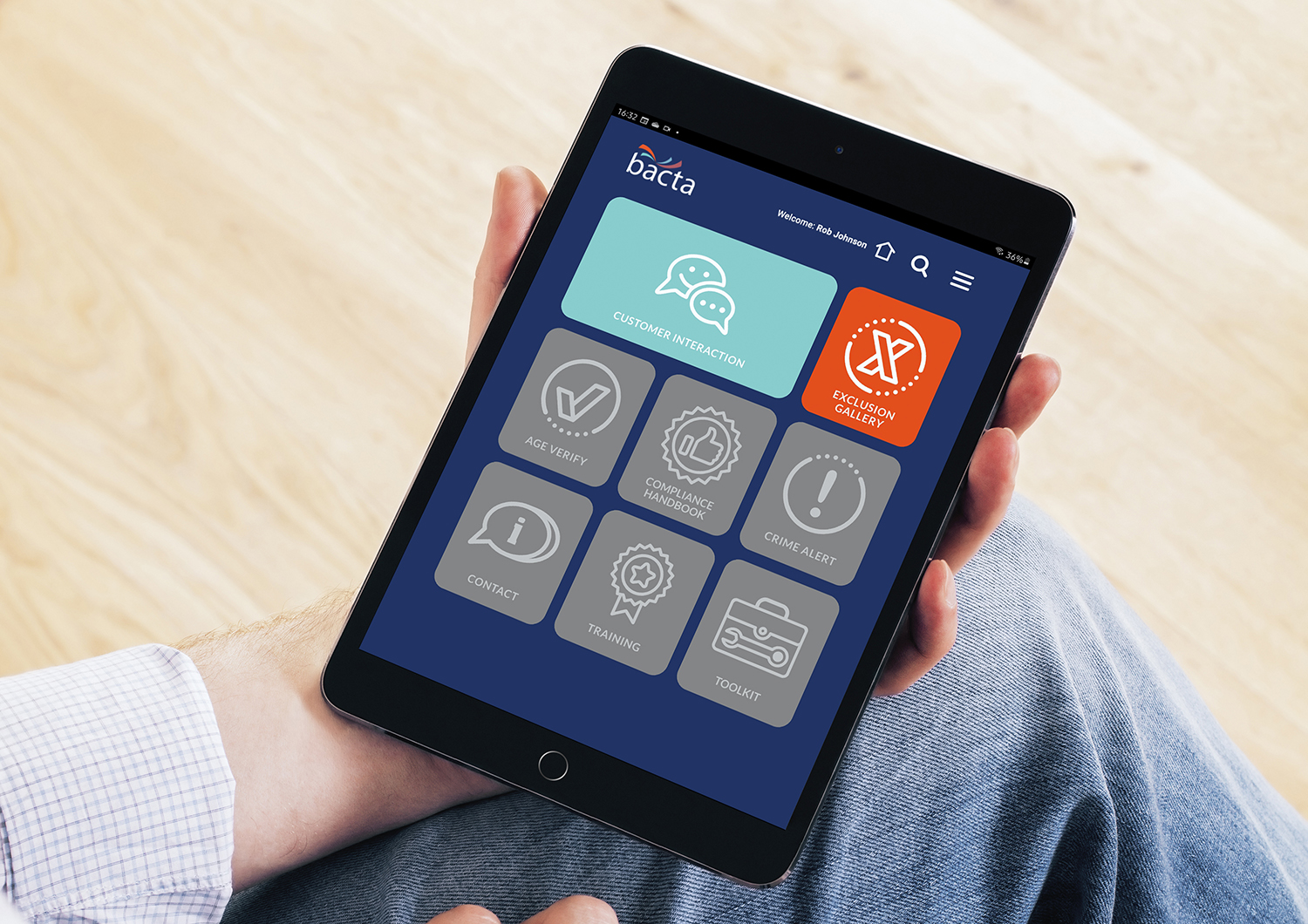 Man holding ipad with Bacta Portal dashboard on screen
